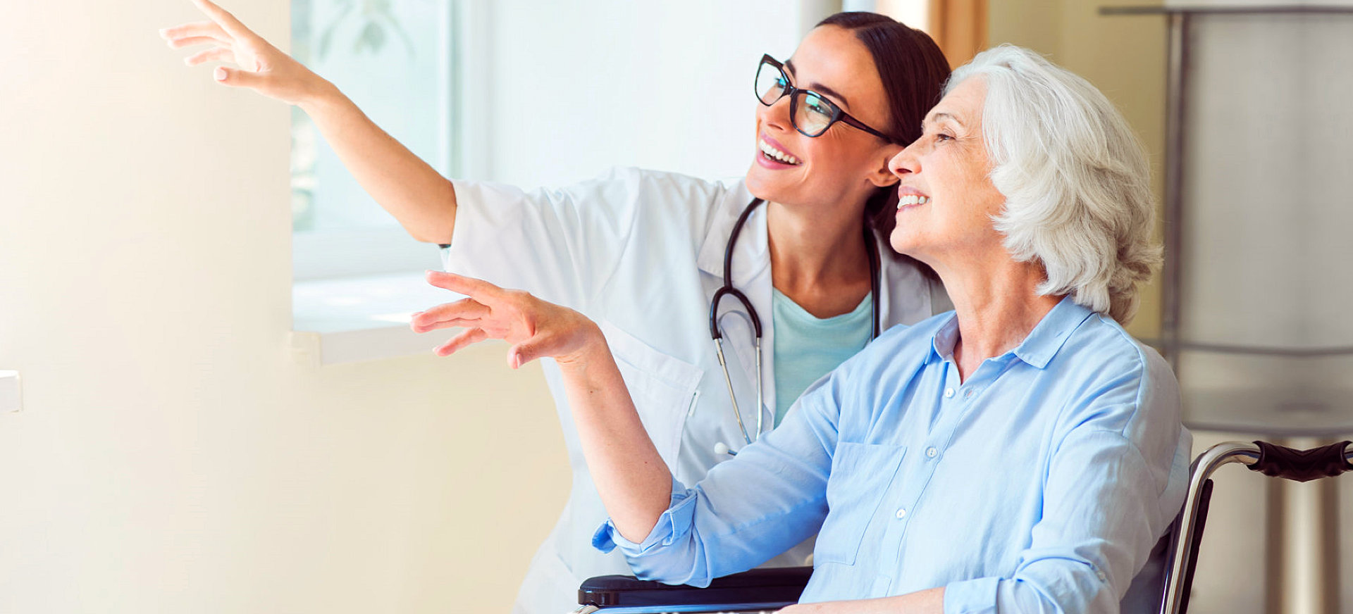 caregiver and elder laughing